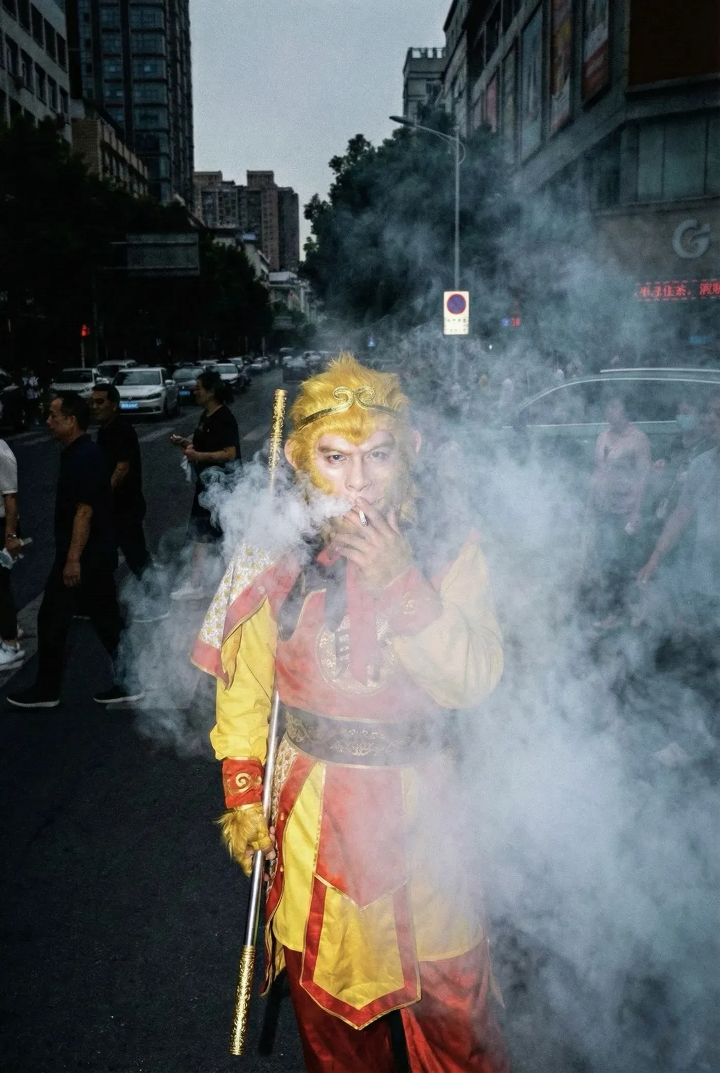 AI-generated street photo of a performer dressed as the Monkey King smoking a cigarette in a cloud of smoke on a city street