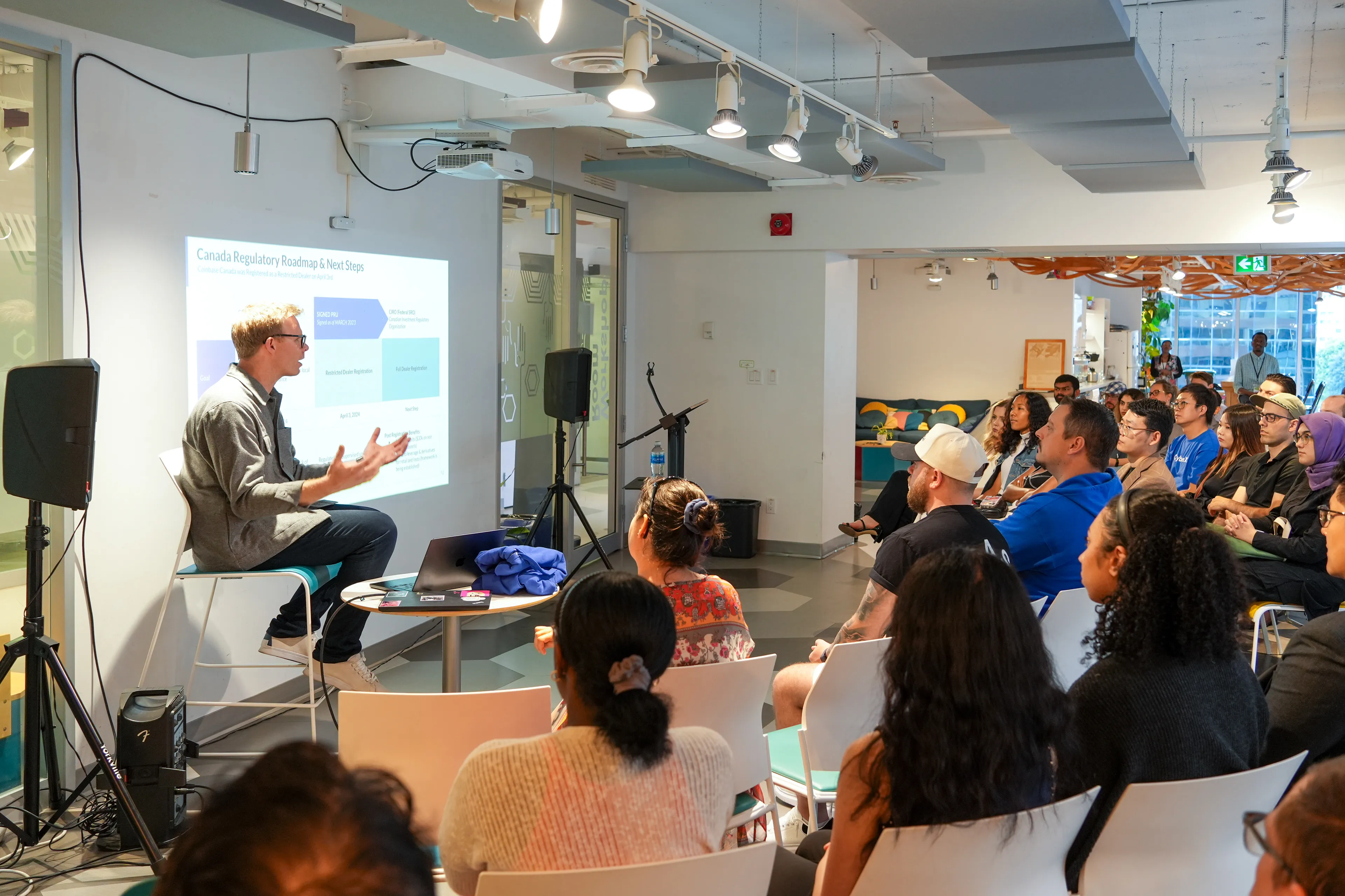 A speaker presents to a full room at the Let’s Bring Ottawa Onchain! meetup.
