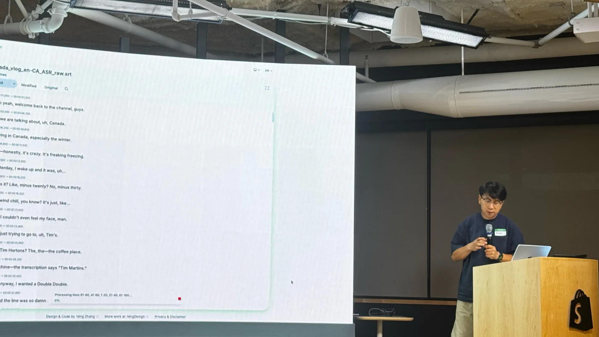 Me presenting SubLime Captions at Shopify Builder Sundays in Ottawa; the screen beside me shows a subtitle file being processed.