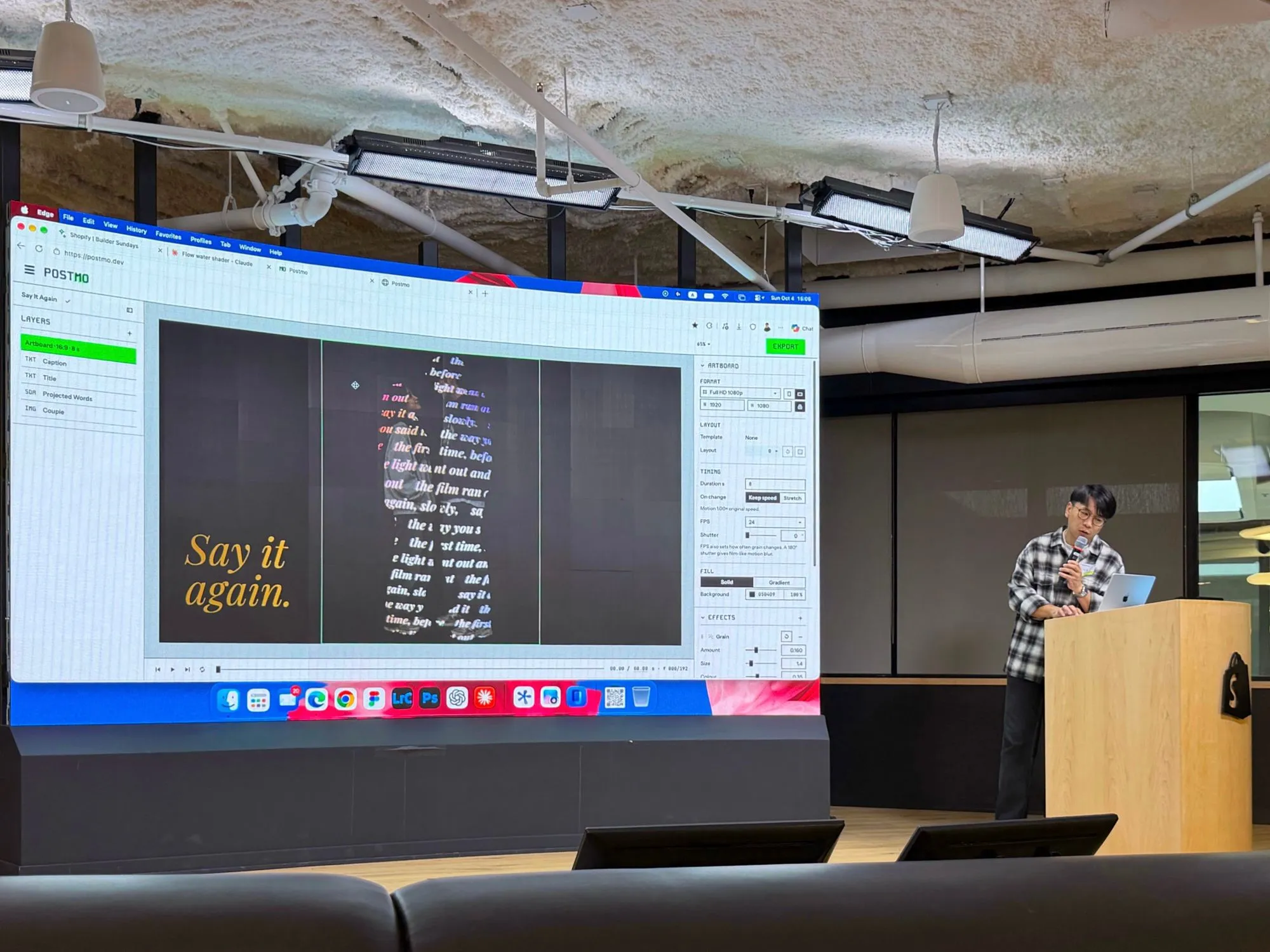 Me at the lectern at Shopify Builder Sundays in Ottawa, presenting Postmo; the LED wall shows its editor with a motion poster that reads Say it again.